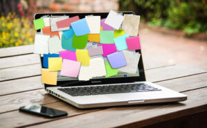 Colorful Post-it Notes on a Laptop for the Corporate and IT Training Page.